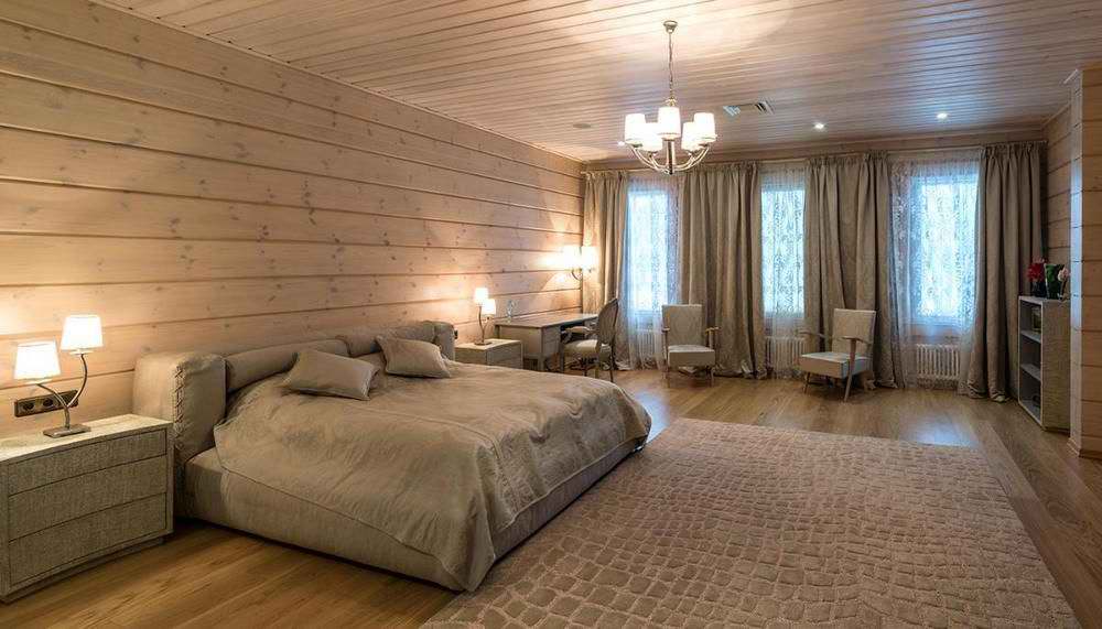 Интерьер спальни в деревянном доме из бруса фото